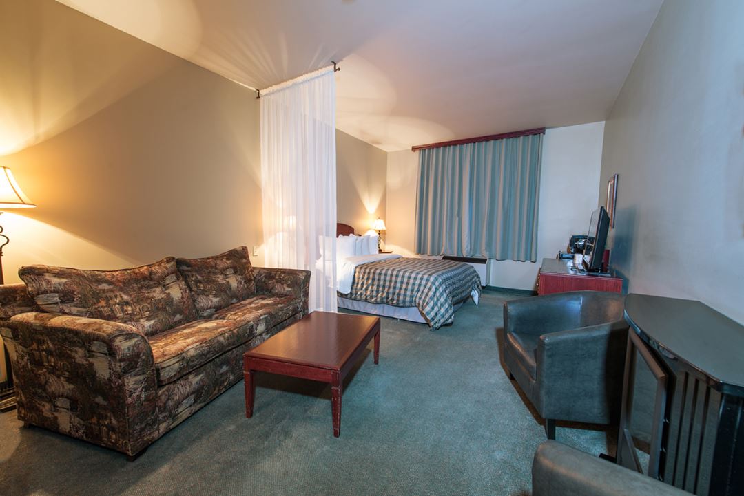 Salon dans une chambre à l'Auberge Val Saint-Côme